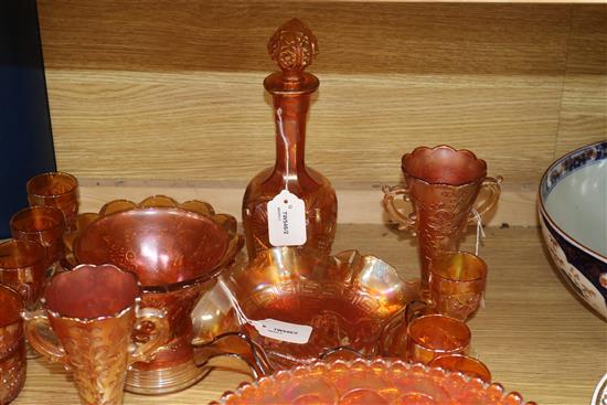 A pair of Carnival glass crucifix candlesticks and a collection of other marigold Carnival glass,